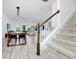 Inviting living space showcasing the staircase, dining area, and living room at 652 Benoi Dr, Davenport, FL 33896