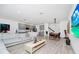 Bright living space with kitchen, living, and dining areas, perfect for modern living at 652 Benoi Dr, Davenport, FL 33896