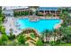 Bird's eye view of a large community pool and mini golf area surrounded by landscaping at 652 Benoi Dr, Davenport, FL 33896