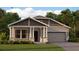 Charming single-Gathering home featuring stone accents, a covered porch, and a two-car garage at 652 Terrapin Dr, Debary, FL 32713