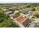 Aerial view of neighborhood with tree lined streets and ponds at 6819 Belmar Dr, Orlando, FL 32807