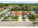 Aerial shot of a neighborhood with well-kept lawns, palm trees, and mature trees at 6819 Belmar Dr, Orlando, FL 32807