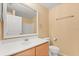 Bathroom features vanity, mirror, and toilet at 6819 Belmar Dr, Orlando, FL 32807