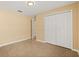 Bedroom features neutral colors, tile flooring, and closet at 6819 Belmar Dr, Orlando, FL 32807