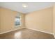 Empty bedroom with tile floors, a window for natural light, and neutral walls at 6819 Belmar Dr, Orlando, FL 32807