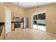 Modern kitchen with stainless steel appliances and a sliding glass door leading to the backyard at 6819 Belmar Dr, Orlando, FL 32807