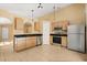 Well-equipped kitchen featuring stainless steel appliances, wood cabinets, and granite countertops at 6819 Belmar Dr, Orlando, FL 32807