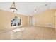 Bright and airy living room featuring tile flooring, a ceiling fan, and a large window at 6819 Belmar Dr, Orlando, FL 32807