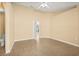 Spacious main bedroom with tile floors, ceiling fan and attached bathroom at 6819 Belmar Dr, Orlando, FL 32807