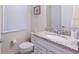 Bathroom view highlighting the vanity with granite countertops and modern fixtures at 7352 Oakmoss Loop, Davenport, FL 33837