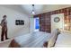 Charming bedroom with Harry Potter theme featuring a book wall and whimsical decor at 7352 Oakmoss Loop, Davenport, FL 33837