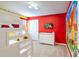 Bright, themed bedroom featuring a bunk bed, dresser, and cheerful wall decor at 7352 Oakmoss Loop, Davenport, FL 33837