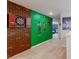 Bright hallway with superhero-themed decor, including a dartboard and colorful wall art at 7352 Oakmoss Loop, Davenport, FL 33837