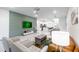 Stylish living room with modern decor, comfortable seating, and an open layout perfect for entertaining at 7352 Oakmoss Loop, Davenport, FL 33837