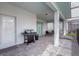 Outdoor patio with dining set and grill perfect for entertaining at 7352 Oakmoss Loop, Davenport, FL 33837