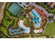 Overhead view of community amenities including pool, playground, tennis courts, and clubhouse at 7577 Oak Spring Ln, Davenport, FL 33837