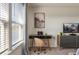 Bedroom featuring a desk and a view of the lake at 7577 Oak Spring Ln, Davenport, FL 33837