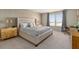 A luxurious main bedroom boasting a comfortable king-size bed and stylish furnishings at 7577 Oak Spring Ln, Davenport, FL 33837