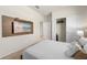 Comfortable bedroom with closet, mounted television and modern decor at 7577 Oak Spring Ln, Davenport, FL 33837