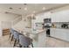 Modern kitchen island with granite counters, stainless appliances, and pendant lighting at 7577 Oak Spring Ln, Davenport, FL 33837