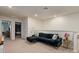 Cozy upstairs living area featuring a large sectional sofa and access to the bedrooms at 7577 Oak Spring Ln, Davenport, FL 33837