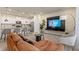 Open-concept living room and kitchen featuring modern finishes and stylish furnishings at 7577 Oak Spring Ln, Davenport, FL 33837