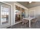 Covered patio features stylish outdoor furniture, ideal for al fresco dining and entertaining at 7577 Oak Spring Ln, Davenport, FL 33837