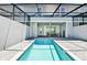 The inviting, screened-in pool offers a refreshing escape in a private setting at 7577 Oak Spring Ln, Davenport, FL 33837