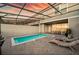 Beautiful backyard pool with lounge area, grill, and covered patio dining, great for relaxing at 7577 Oak Spring Ln, Davenport, FL 33837