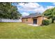 Spacious backyard with a well-maintained lawn and a private fence at 805 Gordonia Ct, Deland, FL 32724
