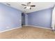 Bright and airy bedroom with a ceiling fan, carpeted floor, and natural light at 805 Gordonia Ct, Deland, FL 32724