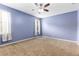 Spacious bedroom with carpet flooring, ceiling fan, and natural light at 805 Gordonia Ct, Deland, FL 32724
