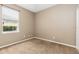 Bedroom with neutral carpet, light walls, and a window providing natural light at 805 Gordonia Ct, Deland, FL 32724