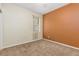 Bedroom featuring neutral carpet and a colorful accent wall at 805 Gordonia Ct, Deland, FL 32724