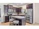 Updated kitchen featuring stainless steel appliances, granite countertops, and kitchen island at 805 Gordonia Ct, Deland, FL 32724