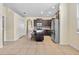 Open kitchen with dark wood cabinets, stainless appliances, and center island at 805 Gordonia Ct, Deland, FL 32724