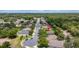 Nice street view of homes in a suburban neighborhood with mature trees and landscaped yards at 805 Gordonia Ct, Deland, FL 32724