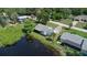 Aerial view of single-story home with a screened in patio with access to the canal at 8121 Via Bonita, Sanford, FL 32771