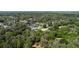 Aerial view of single-story home with a freshwater canal surrounded by lush greenery at 8121 Via Bonita, Sanford, FL 32771