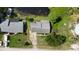 Aerial view of a single-story home with an attached garage and established landscaping at 8121 Via Bonita, Sanford, FL 32771