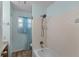 Bright bathroom with a shower and tub combination with a window providing natural light at 8121 Via Bonita, Sanford, FL 32771