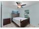 Bedroom featuring a comfortable bed, a ceiling fan, a window and tiled flooring at 8121 Via Bonita, Sanford, FL 32771
