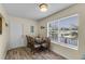Cozy dining room features wood-look floors and large windows overlooking the water at 8121 Via Bonita, Sanford, FL 32771