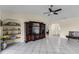 Bright living room features tile flooring, neutral walls, and a ceiling fan at 8121 Via Bonita, Sanford, FL 32771