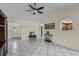 Open living room with tile flooring, neutral paint, and a view to other rooms at 8121 Via Bonita, Sanford, FL 32771