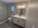 Modern bathroom featuring a new vanity, updated lighting, and a stylish walk-in shower at 838 Haulover Dr, Altamonte Springs, FL 32714