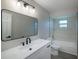 Bathroom featuring modern vanity with a black faucet and a shower/tub combination with tiled walls at 838 Haulover Dr, Altamonte Springs, FL 32714