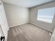 Cozy bedroom with neutral carpet, fresh paint, and a bright window at 838 Haulover Dr, Altamonte Springs, FL 32714