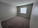 Clean bedroom with neutral carpet, a bright window, and freshly painted walls at 838 Haulover Dr, Altamonte Springs, FL 32714