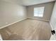 Comfortable bedroom with neutral carpet, natural light and ample space at 838 Haulover Dr, Altamonte Springs, FL 32714
